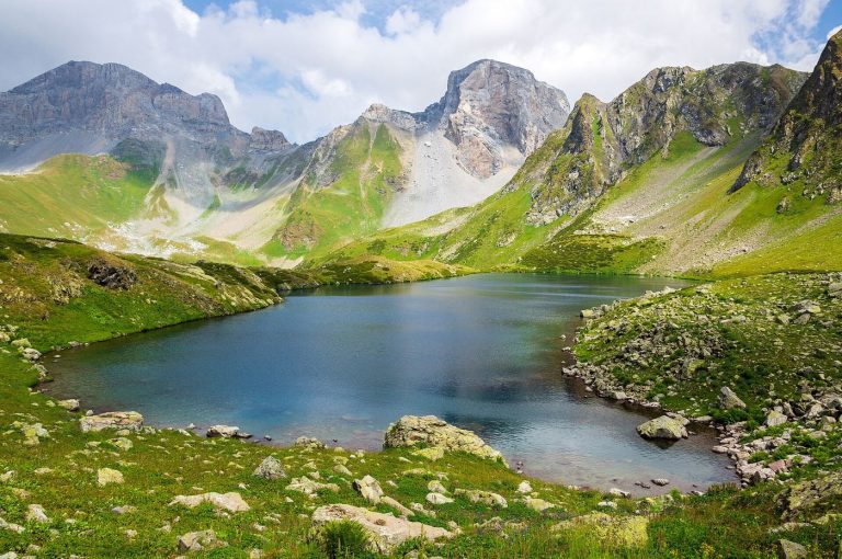 mountain valley with a glacial lake where ice has recently retreated
