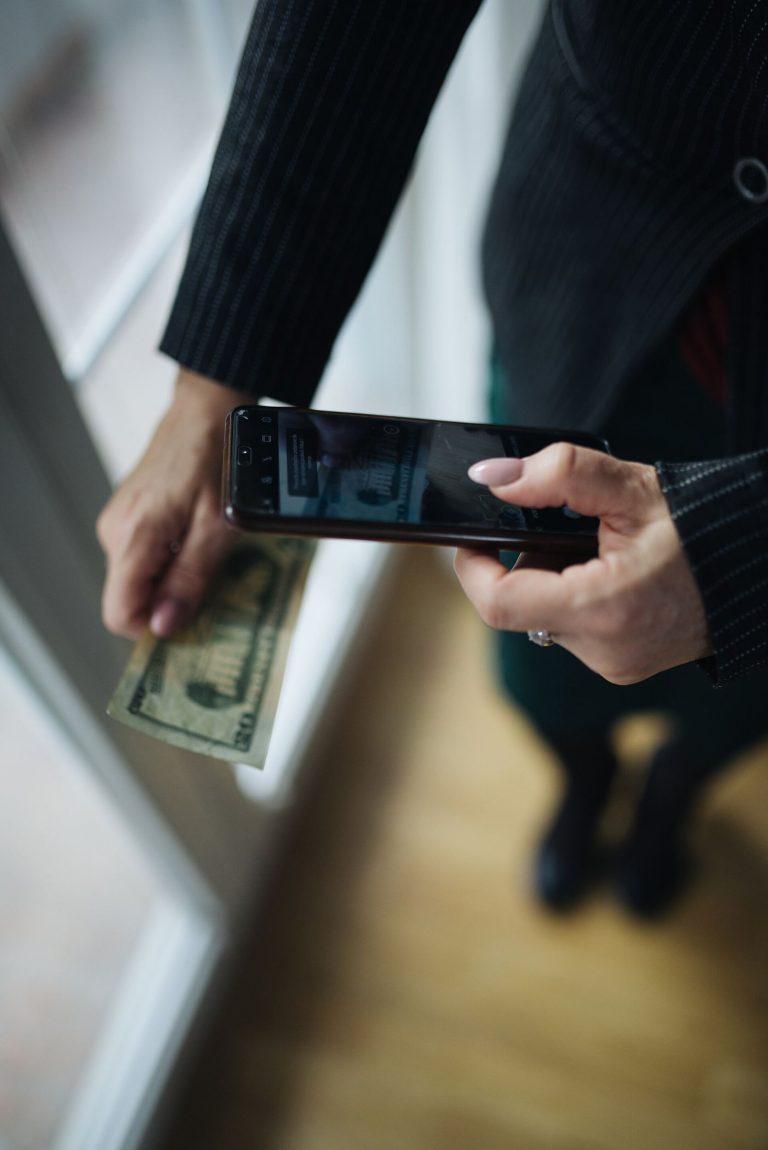 hand holding a smartphone to make a payment