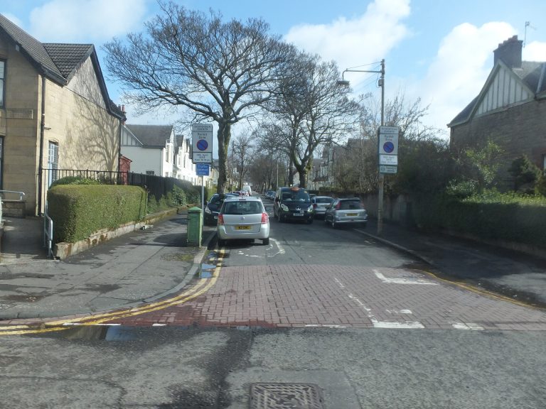 Housing Market Shifts: Buyers and Sellers Recalibrate A street of residential houses in a suburban neighbourhood